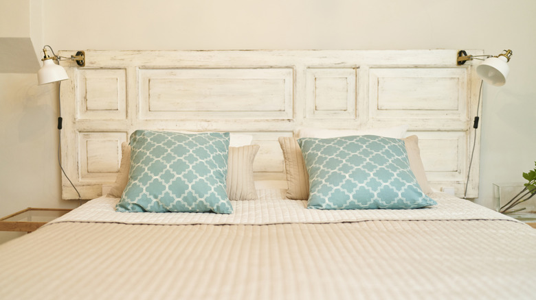 Bed with rustic door headboard