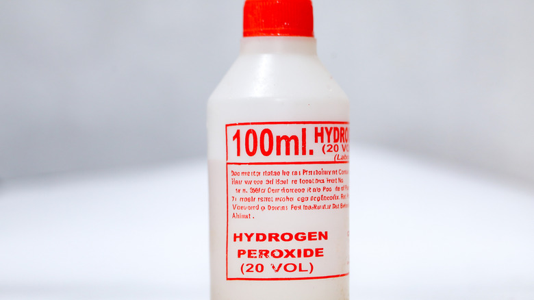 a bottle of hydrogen peroxide against white background