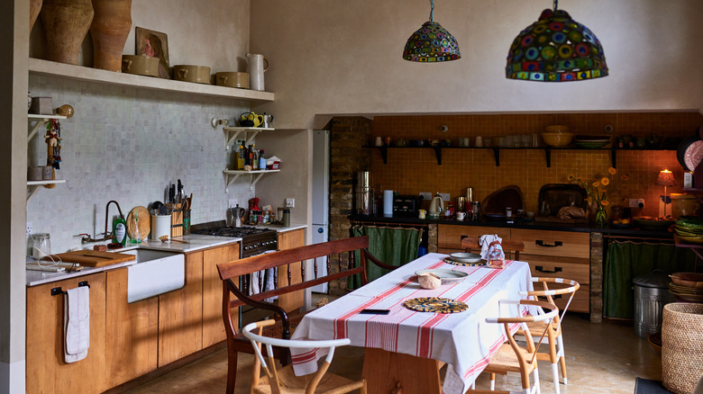 A wide shot of a lived-in, rustic kitchen.