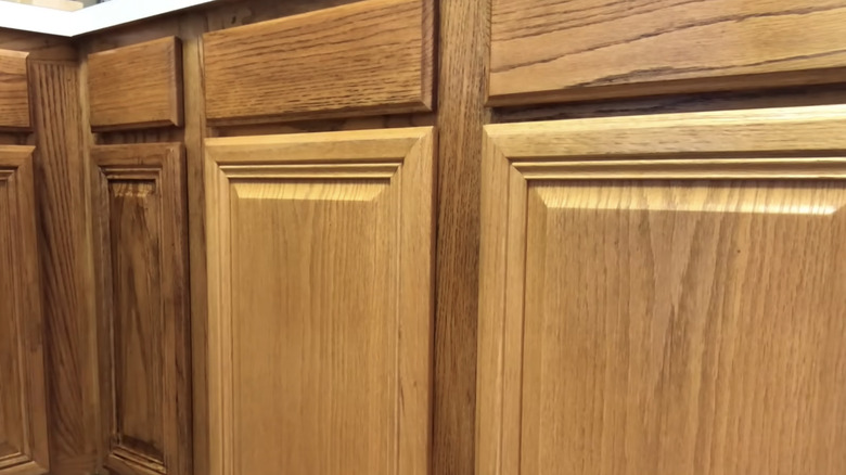 Wood cabinets before and after an application of Briwax