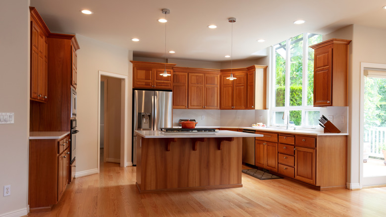 A large kitchen with warm-toned wood cabinetry