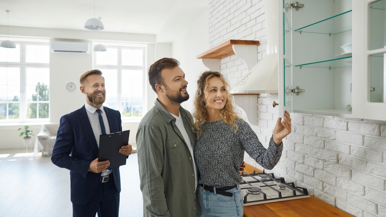 Couple looking at kitchen cabinets