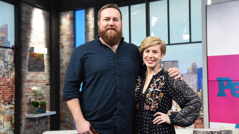 Erin and Ben Napier on the set of a TV show.