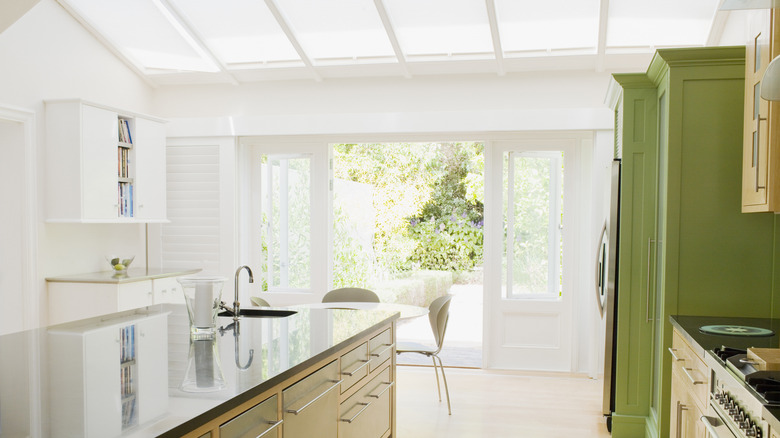 kitchen with open French doors and skylights