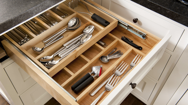 Kitchen silverware drawer with compartments.