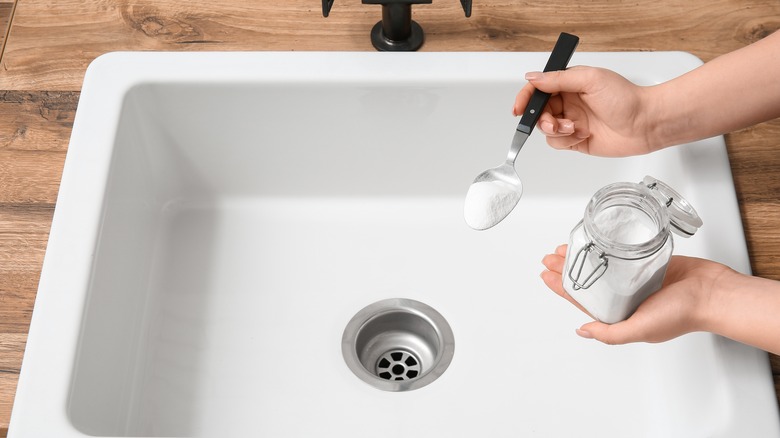 Baking soda cleaning porcelain sink