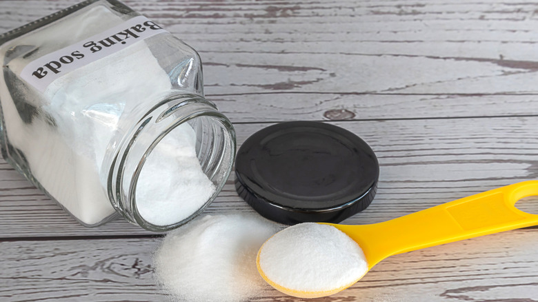 Baking soda on wooden background