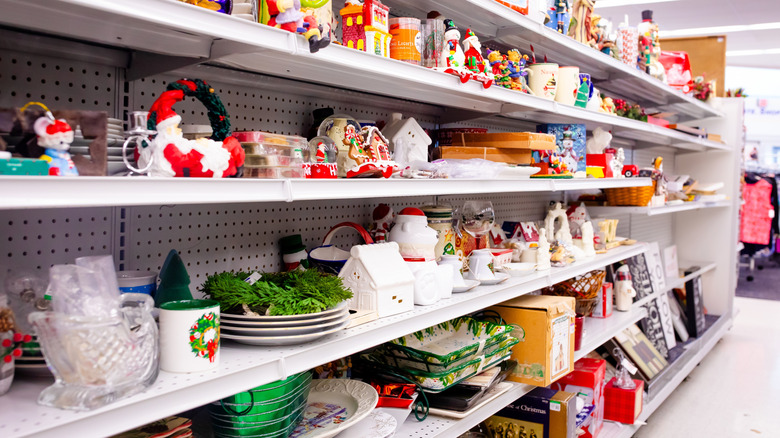 Shelves filled with a variety of housewares in a thrift store