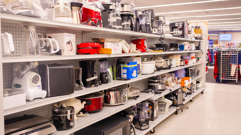 thrift shelves filled with kitchen essentials