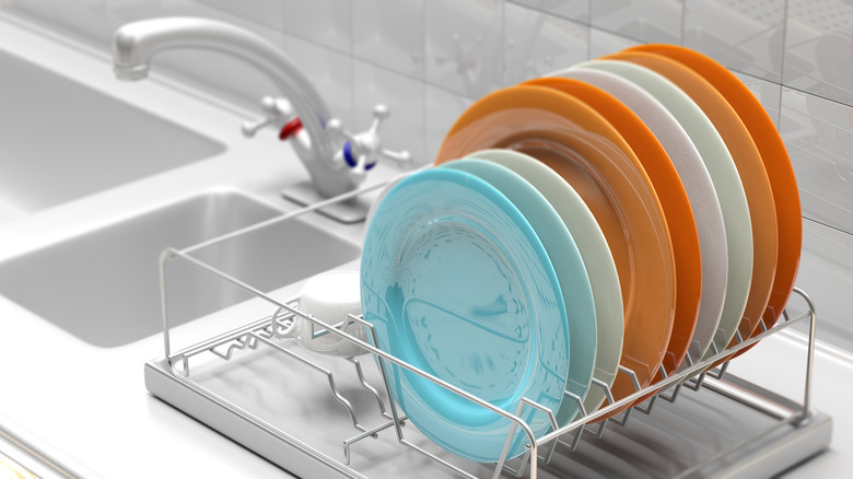 Colorful dishes in a drying rack