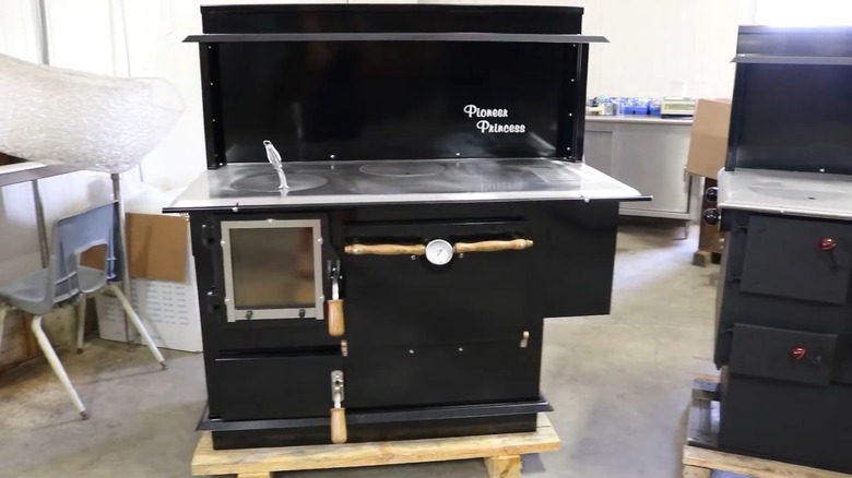 A black Pioneer cookstove in a factory