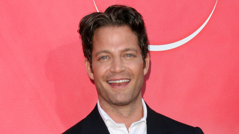 Nate Berkus smiling at a red carpet event