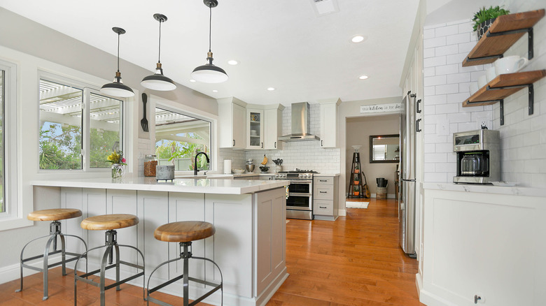 A modern farmhouse kitchen with a coffee nook and dining bar