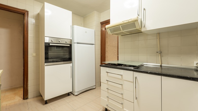 Mismatched appliances in kitchen