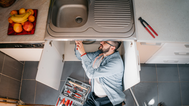 Man fixing sink