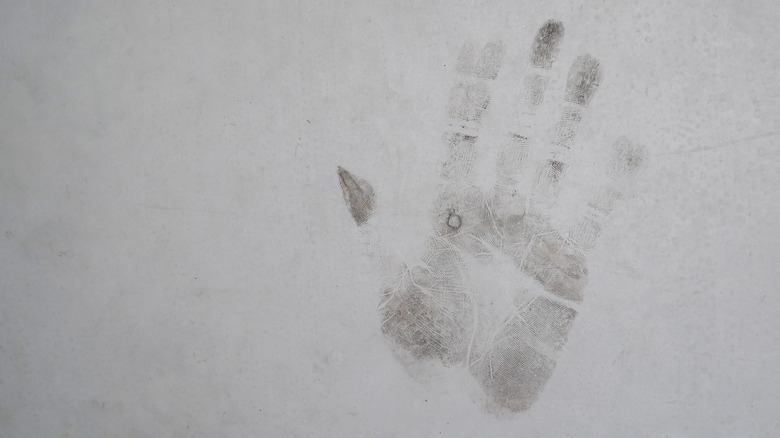 dirty handprint on wall