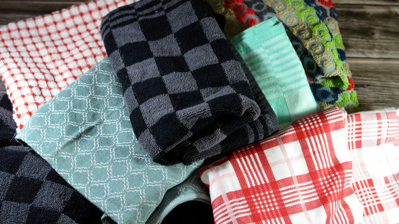 A cluttered pile of kitchen dish towels.