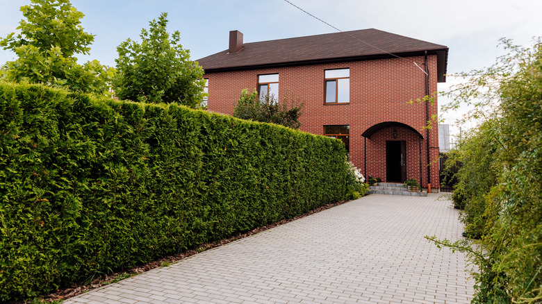 brick house with narrow driveway