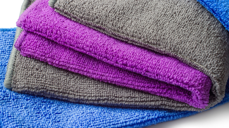 A stack of colorful folded microfiber towels