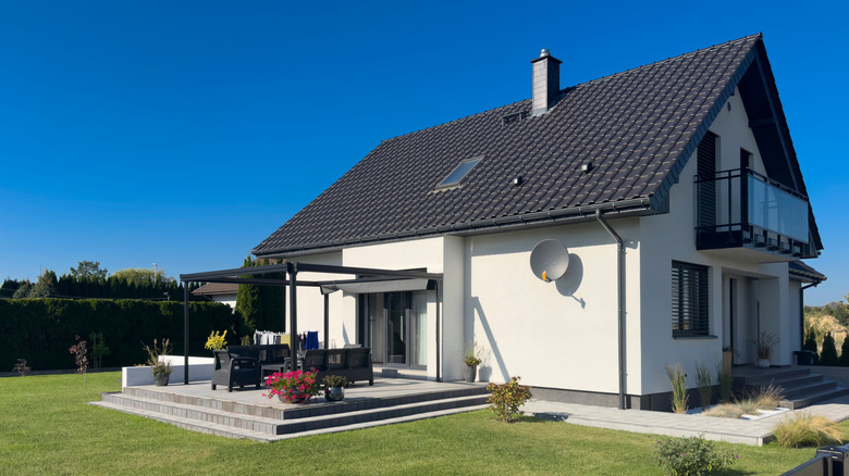 White single family home with green lawn