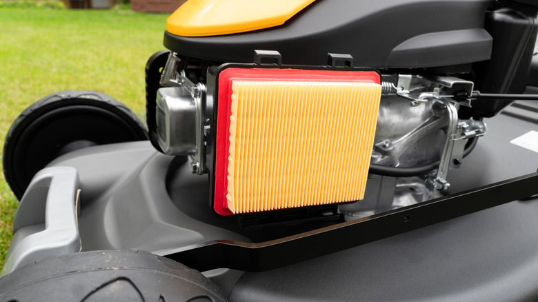 The air filter on a gasoline lawnmower