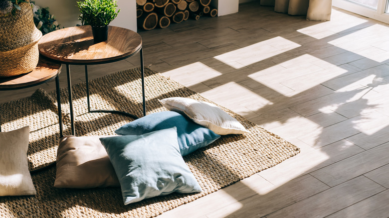 Living room with jute rug beneath coffee tables