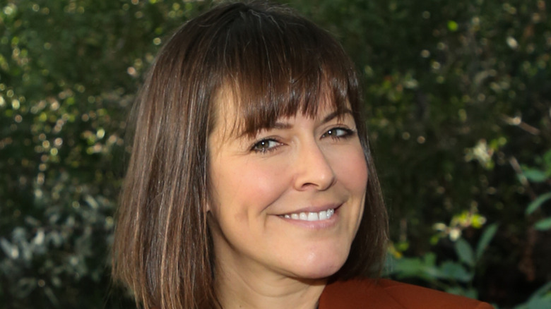 Leanne Ford smiling against greenery