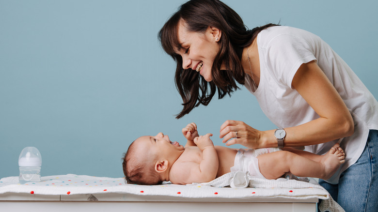 Mom changing baby