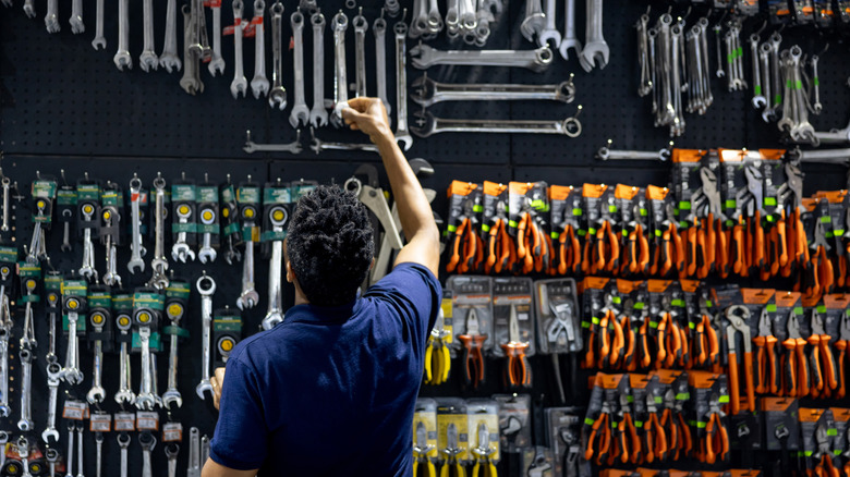 A person looking at new tools in a hardware store