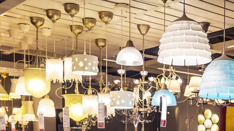 Pendant lights hanging in a lighting store