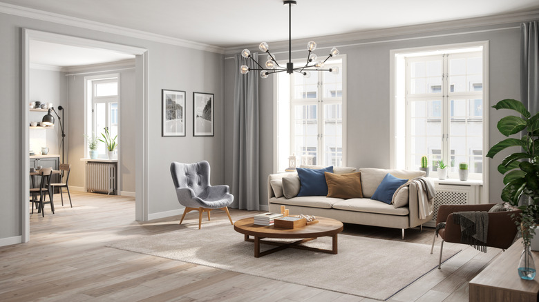 Overhead chandelier in neutral gray room