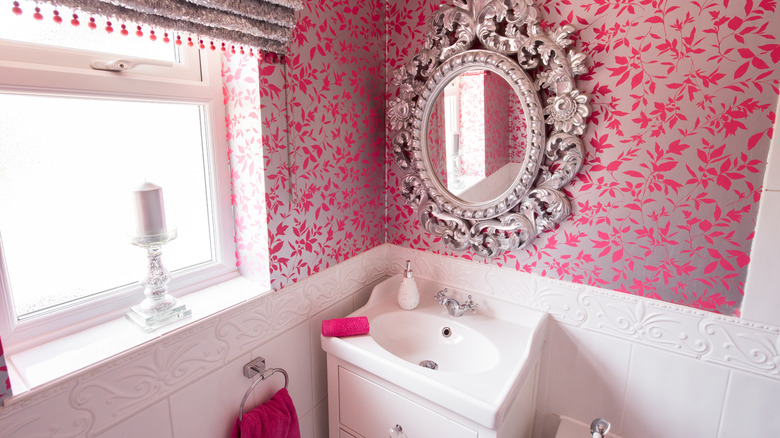 Pink vintage bathroom with mirror and sink