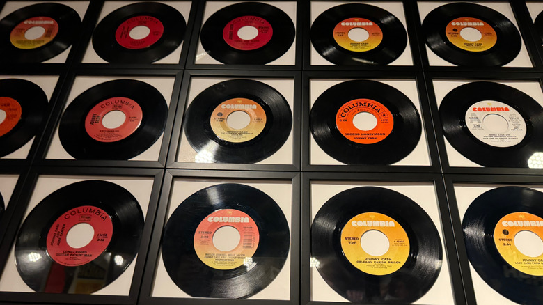 Wall of framed vinyl records out of sleeves