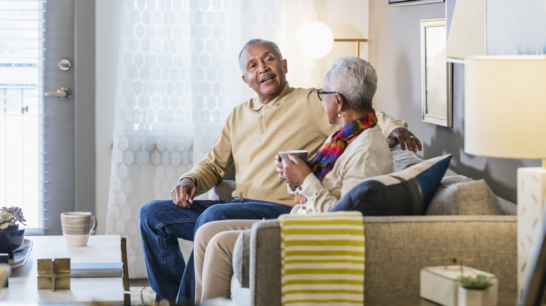 Middle-aged couple spending time together at home