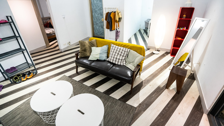Living room with black and white striped floor