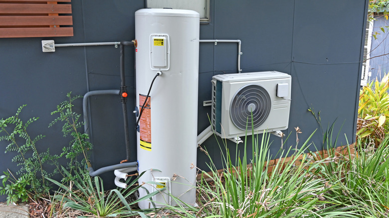 A heat pump water heater installed outdoors