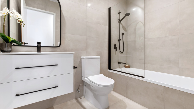 Modern bathroom with neutral-colored tiles