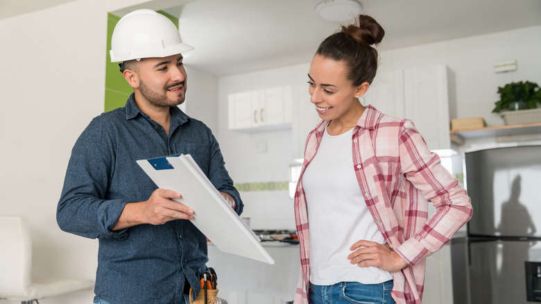 Contractor talking with woman about countertops