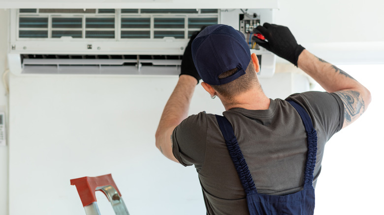 professional working on air conditioner