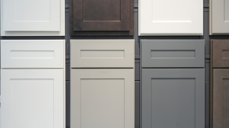 A group of cabinet door fronts on display in various colors.