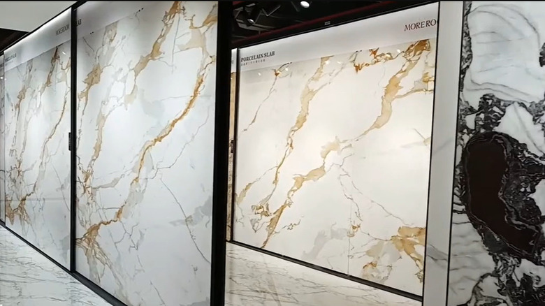 Showroom displaying large slabs of sintered stone in various colors and patterns