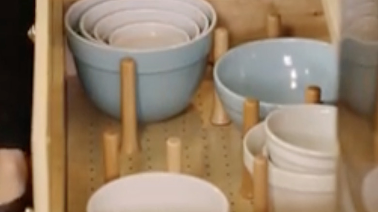 Martha Stewart demonstrates how she uses a peg board to organize kitchen drawers.