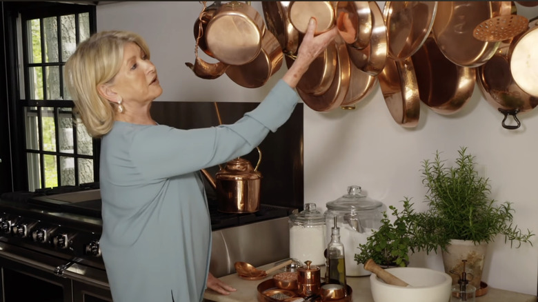 Martha Stewart shows off hanging cookware in her kitchen