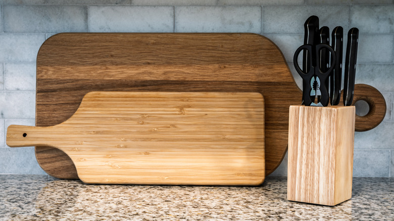 Cutting boards and knives on a counter