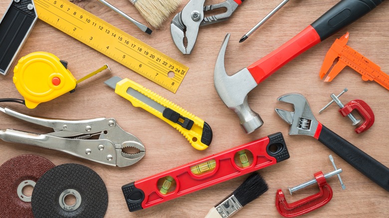 tools arranged on wood table