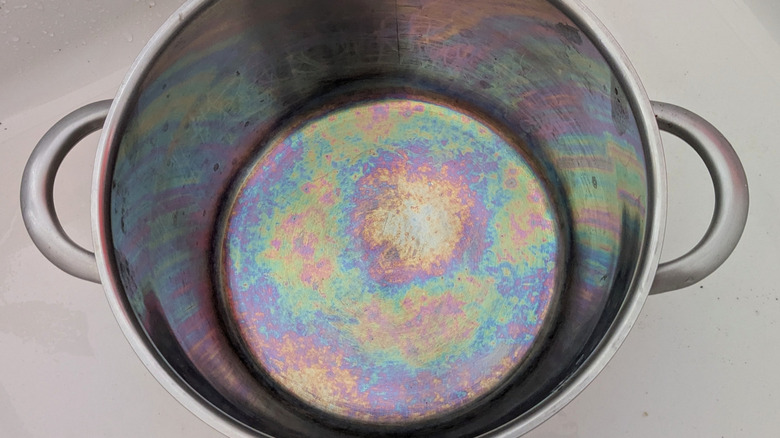 Rainbow coloring at the bottom of a stainless steel pot