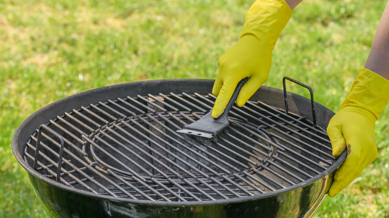Cleaning barbecue grill with wire brush