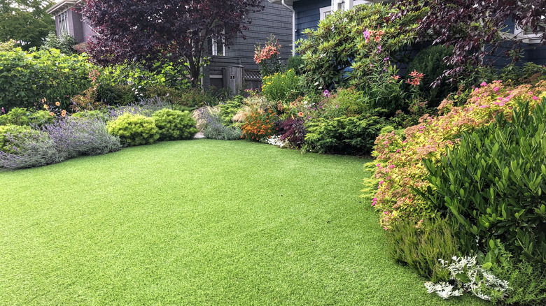 Landscaped yard with artificial turf