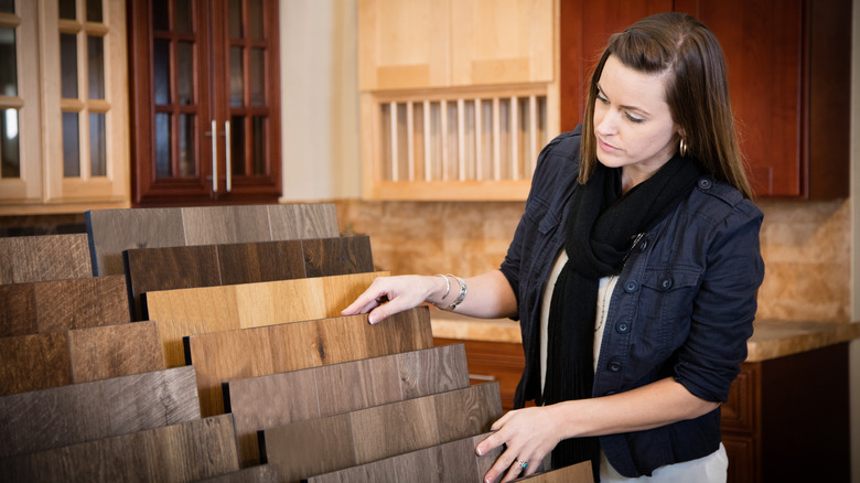 woman looking at flooring samples