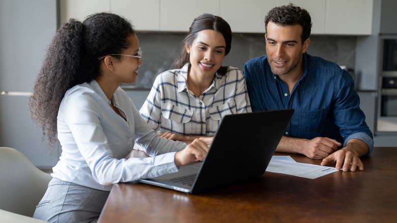 three people in meeting